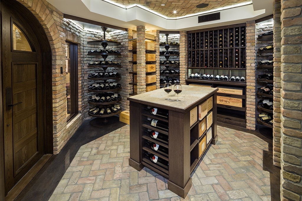 traditional wine cellar with arched door and wooden table