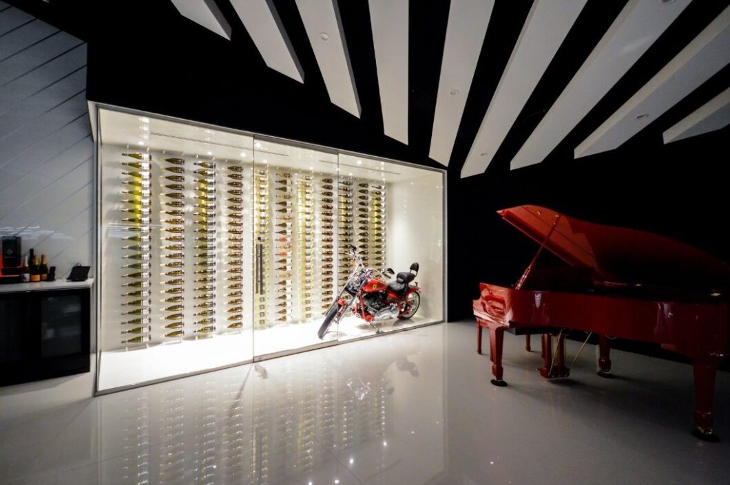Glass enclosed wine wall with motorcycle