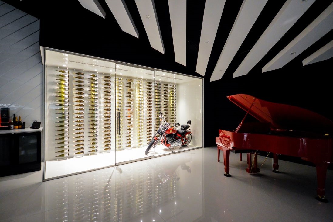 Glass enclosed wine wall with motorcycle