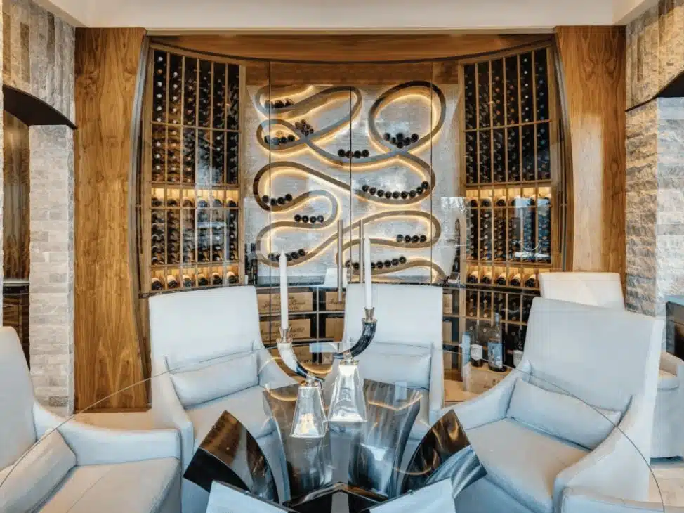 custom solid walnut curved wine display framed by Curve-on-Curve Sommelier Select racking
