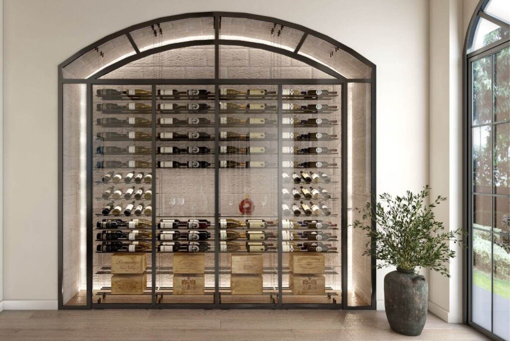 Arched glass enclosed wine wall with metal racks