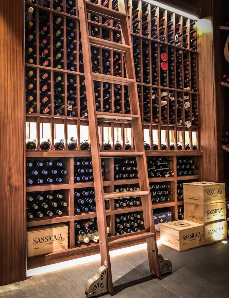 traditional wooden wine cellar with library rolling ladder - Genuwine Cellars design