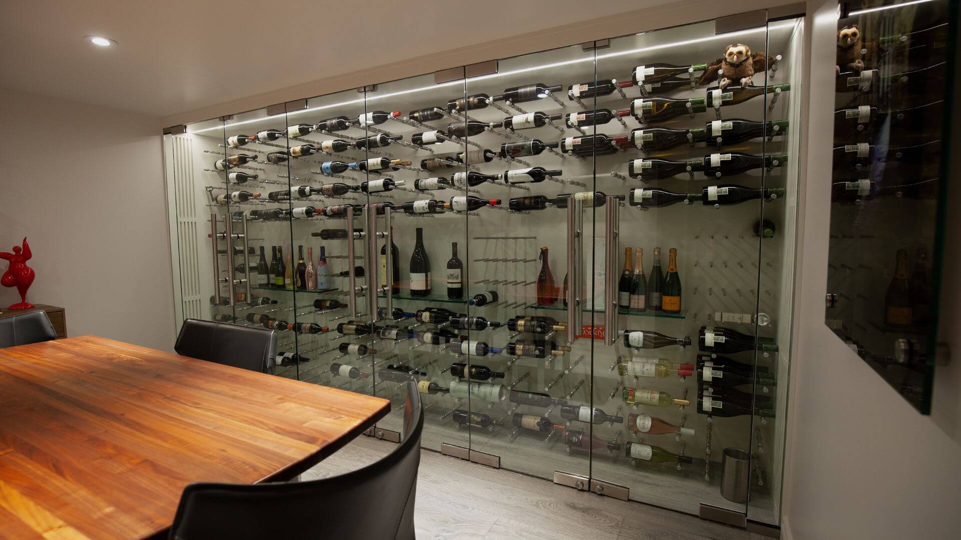 custom glass wine cellar display designed by Genuwine Cellars