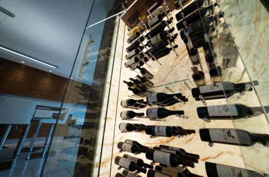 Glass wine wall with metal racking - Genuwine Cellars