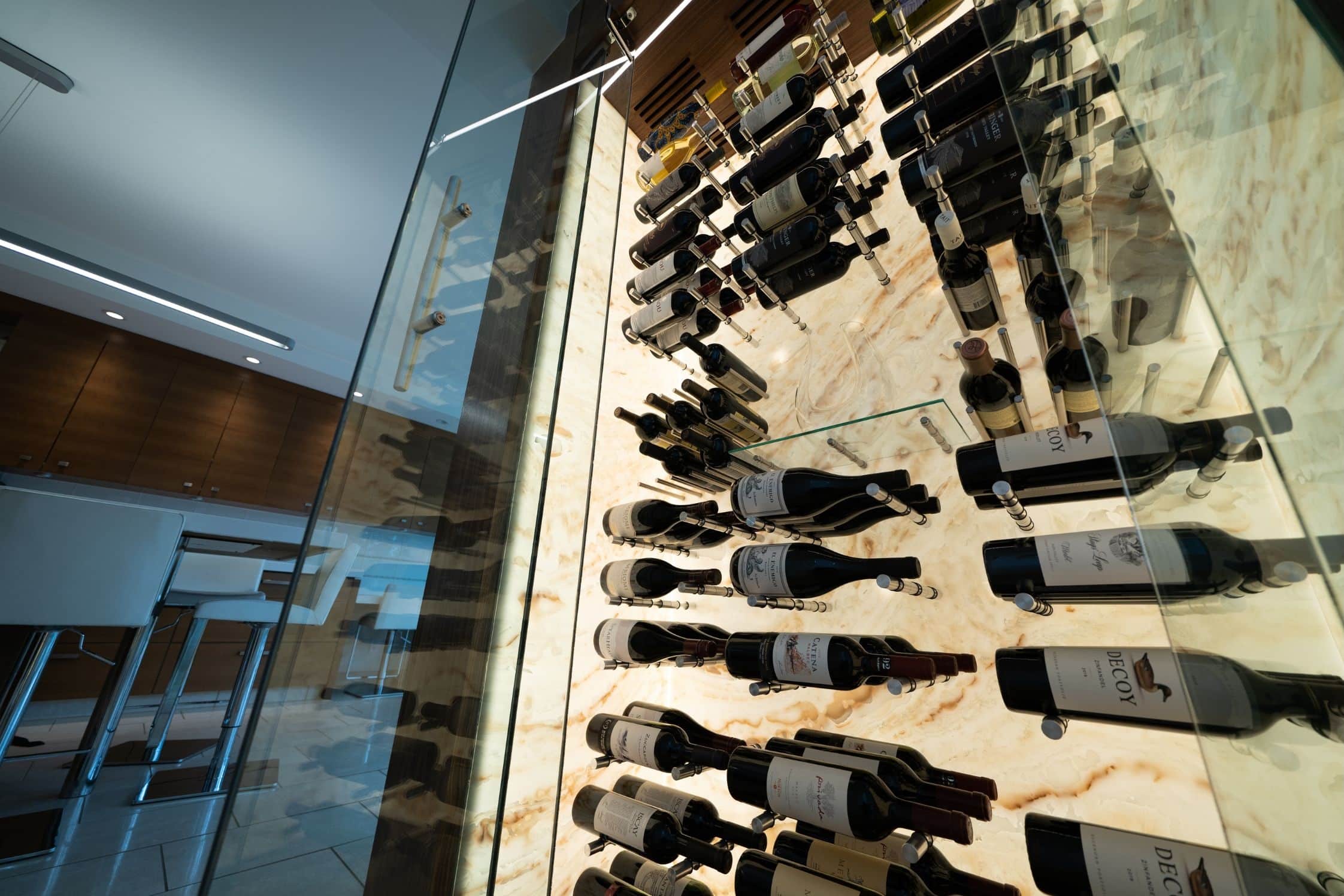 Glass wine wall with metal racking - Genuwine Cellars